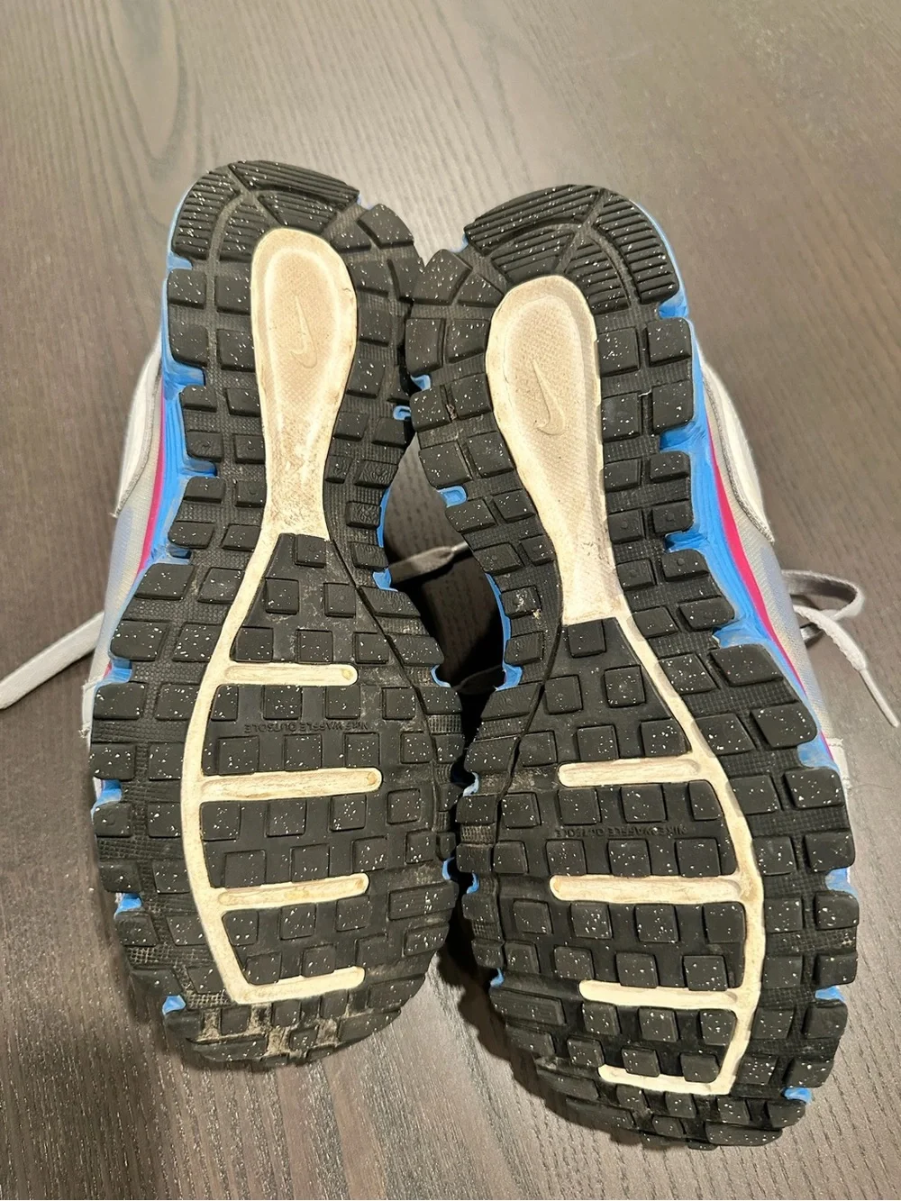 Nike Gray Sneakers with Pink Lining and Blue Accents
